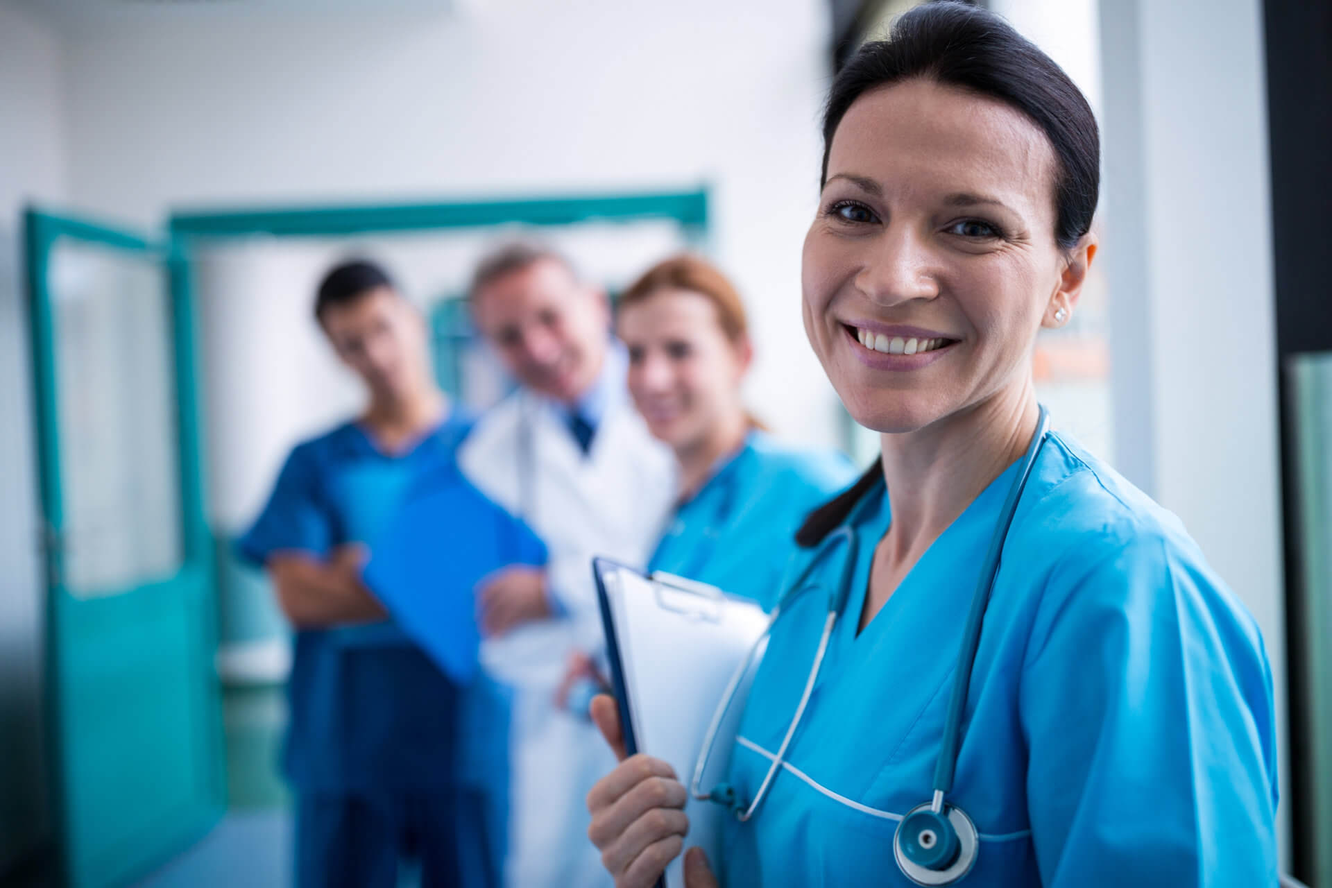 nurses and doctor smiling