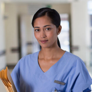 female nurse pose at camera