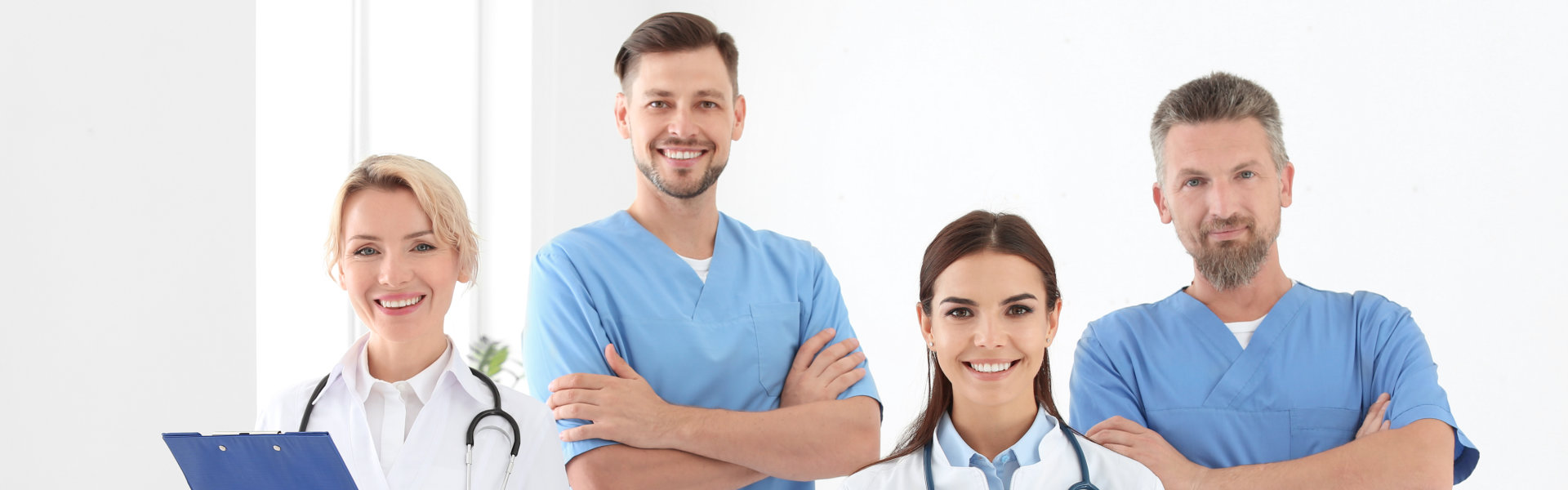 nurses and doctor smiling